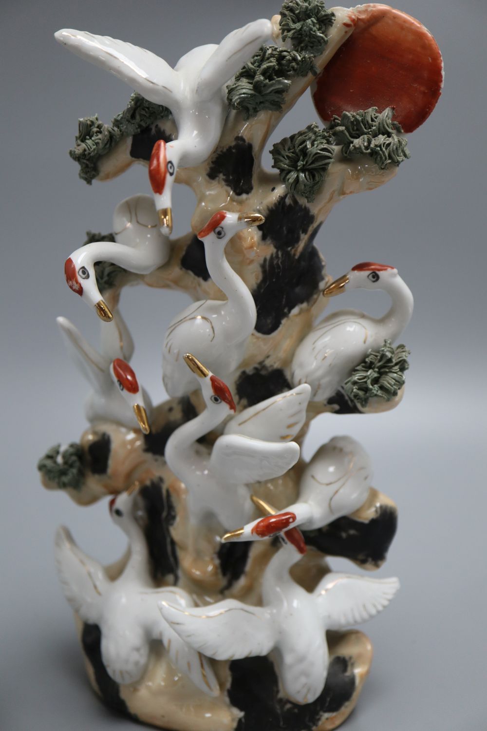 A Chinese blue and white dish, a wall pocket and a bird group, tallest 26cm